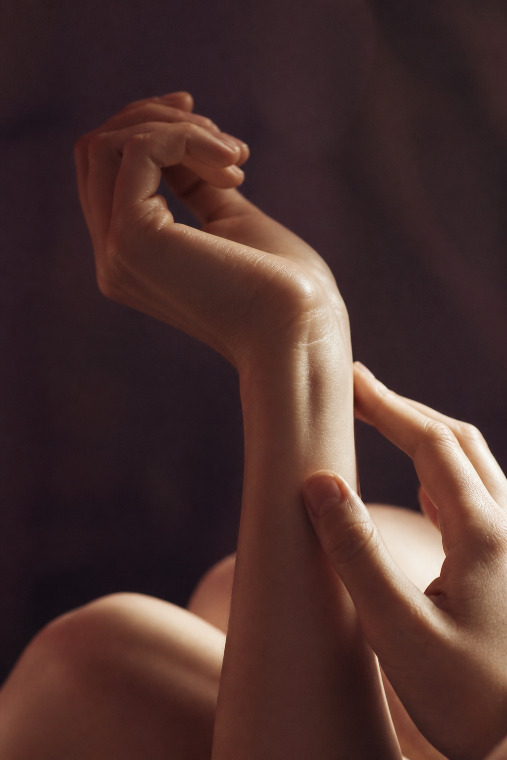 Editorial photograph of hands in warm natural light